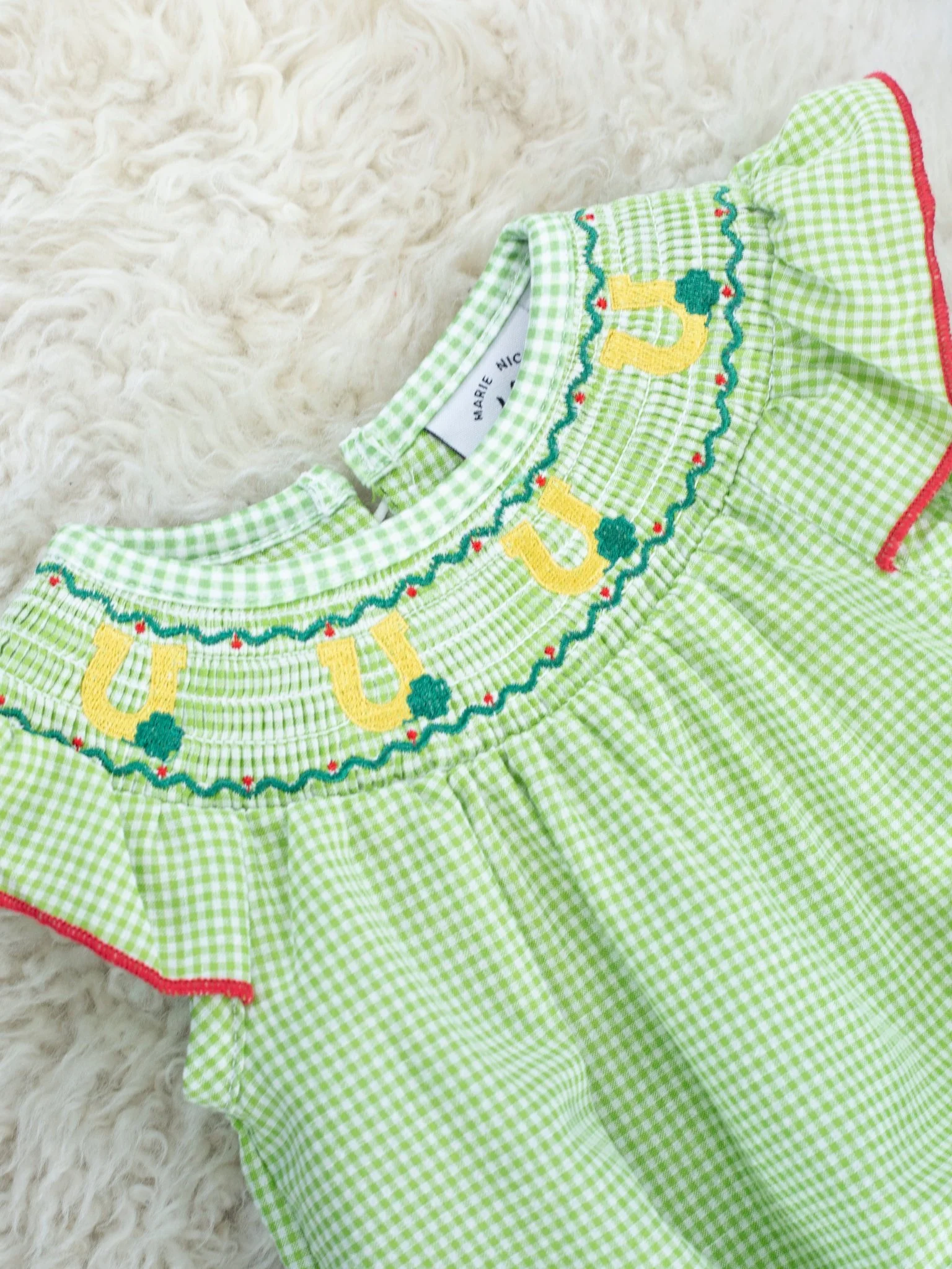 Green Smocked Horse Shoe Ruffle Romper - Image 3