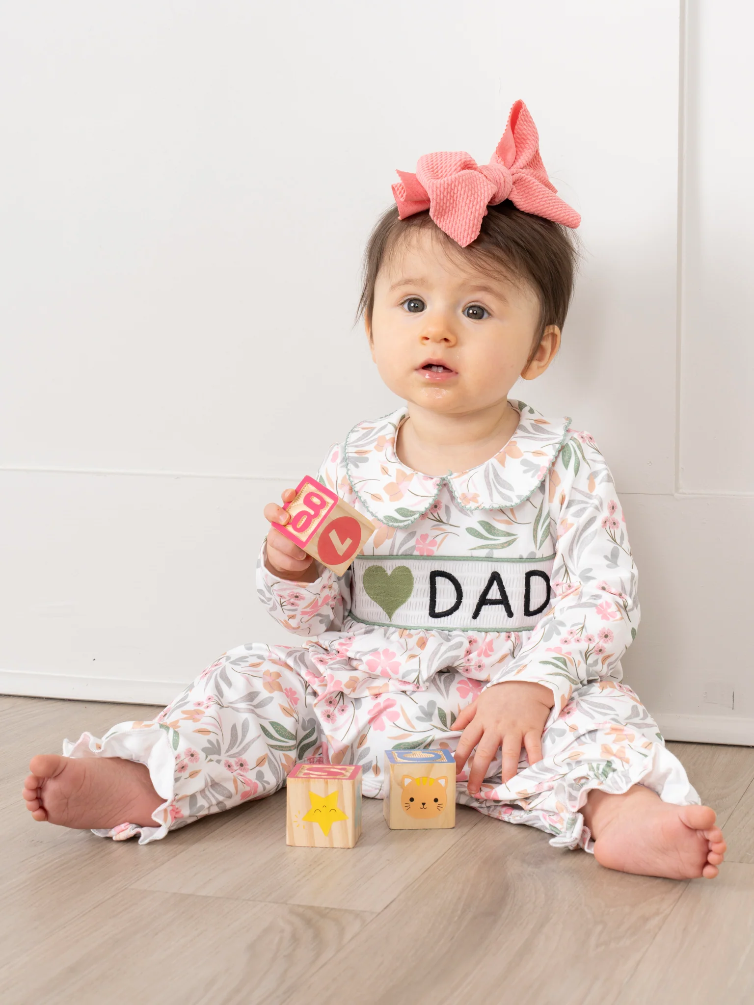 Sweet Olive Floral Smocked Dad Love Ruffle Romper